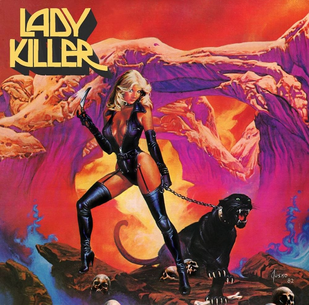 Album cover of Lady Killer - Lady Killer (1983).

It shows a blonde woman with revealing black leather clothes and high leather boots, one hand holding a knife, the other a growling black panther on a chain. The setting is placed in a red canyon landscape with blue smoke coming out of the ground, which is studded with human skulls.