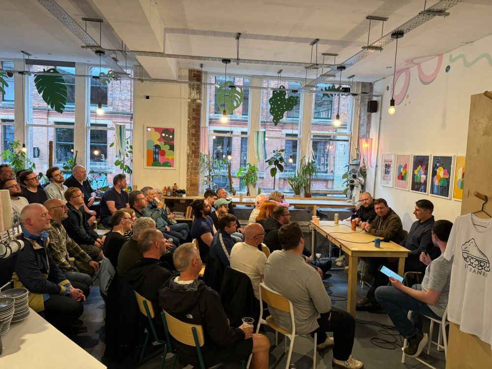 The Blue Moon Podcast Live show recording, showing an audience sitting to the left of the photo and the panel sitting on the right. The panel is made up of Chris Higginbottom, Simon Bajkowski, Paul Lake and David Mooney.