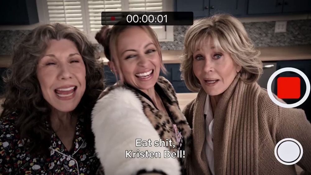 scene from Grace & Frankie in which Grace (Jane Fonda), Frankie (Lily Tomlin) and fictional pop singer Kareena G (Nicole Richie) are recording themselves yelling "Eat shit Kristen Bell"