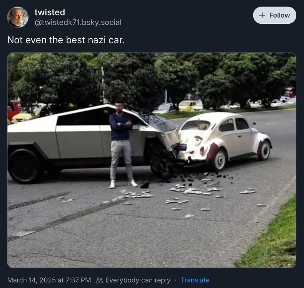 Screen shot of Twitter post.  Photo of an accident between aVolkswagen bug and a Tesla.  The tesla is totaled.  The text reads “twisted @twistedk71.bsky.social
Not even the best nazi car.”