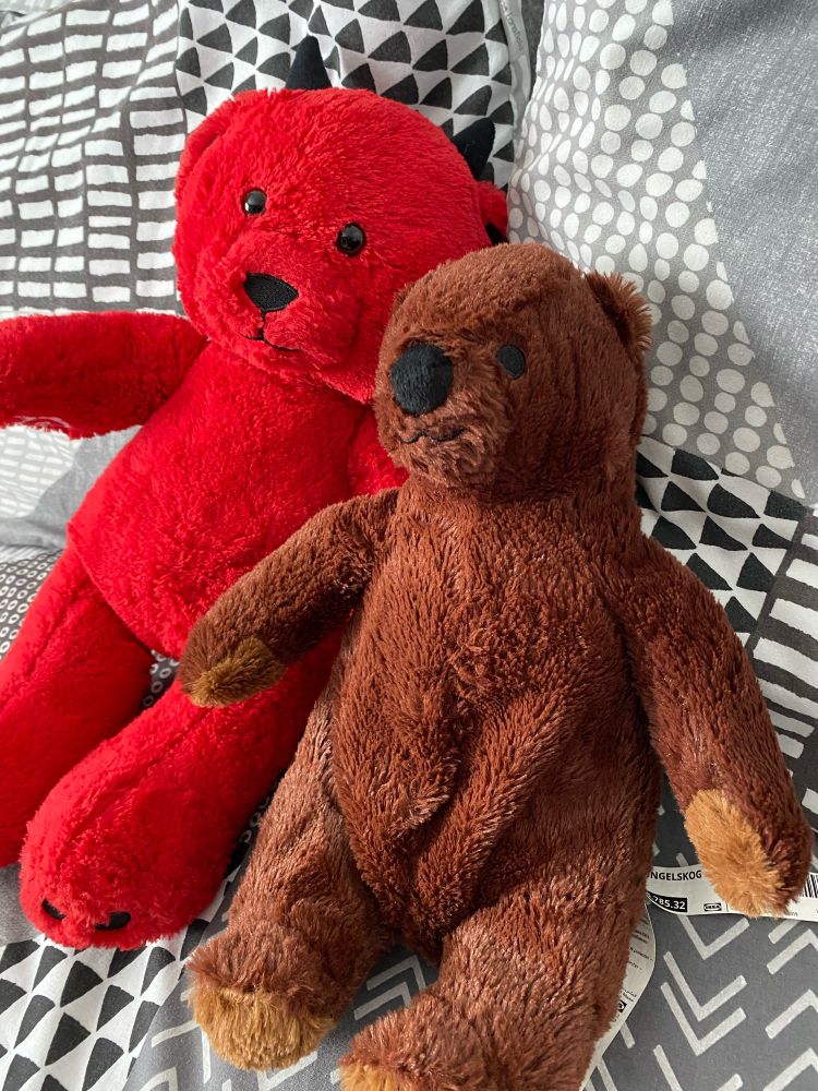 mini djungelskog plushie sat with red demon build a bear plushie, named squashie :)