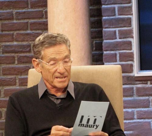 Maury Povich reading off of a card on his TV show