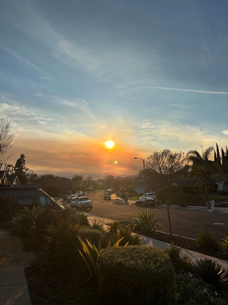 Smokey sky sunset down a suburban street