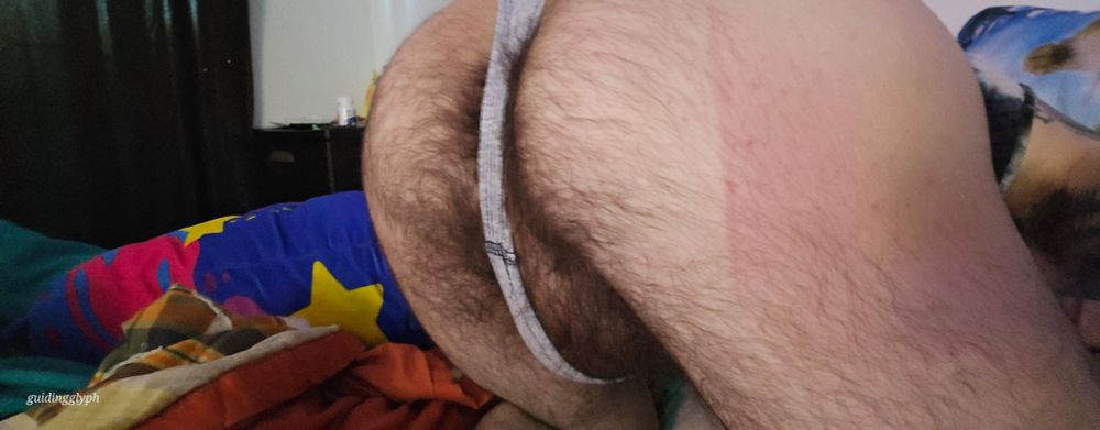 Creature bent over showin off its hairy balls