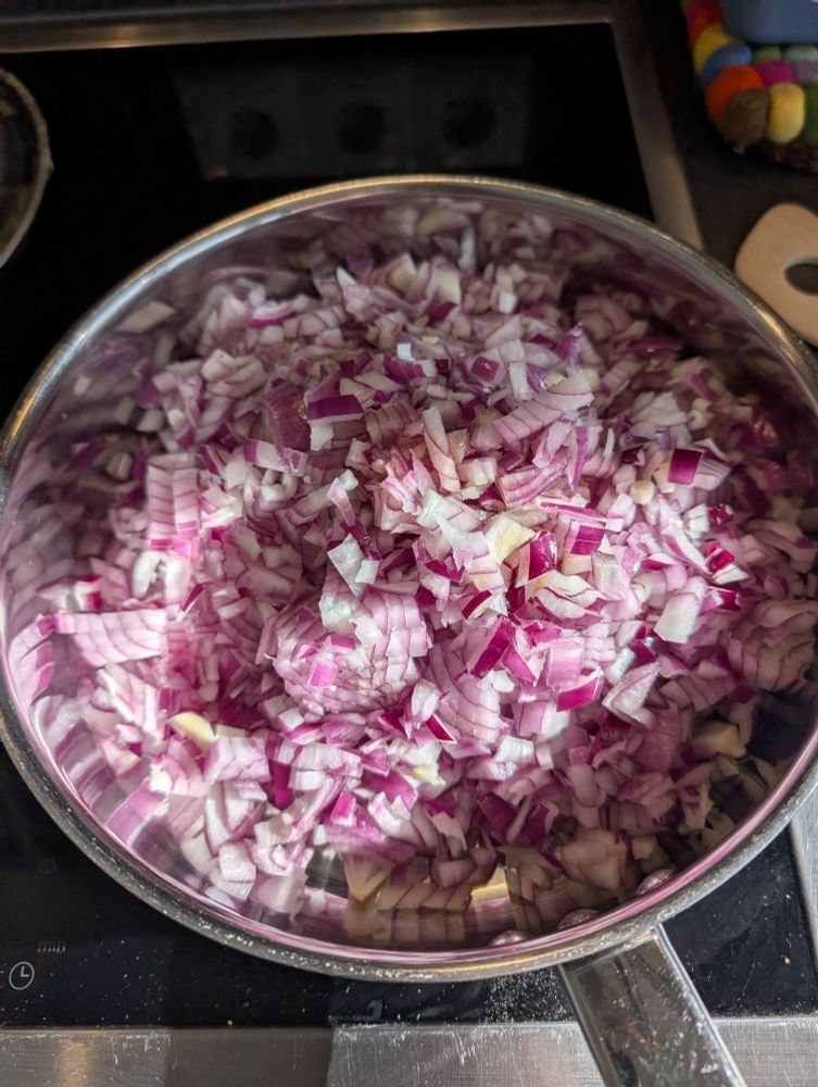 Cut red onions, on their journey towards eternal suffering.