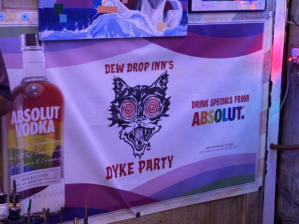Sign for a dyke party at Dew Drop Inn during pride month. A true horror 
