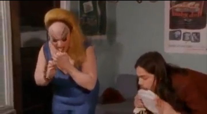 Screenshot. Pink Flamingos (1972) by John Waters

Notorious Baltimore criminal and underground figure Divine ("The Filthiest Person Alive") and another licking things for some reason.