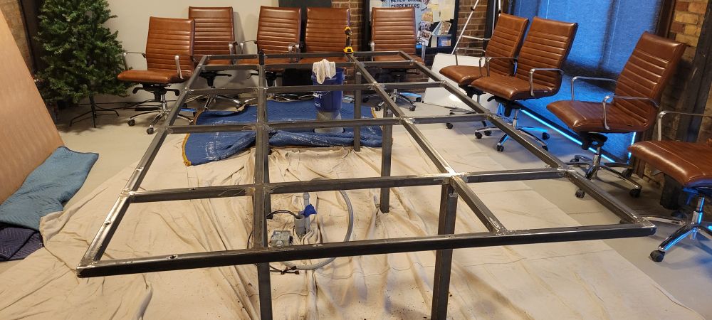 Steel frame for a 12'x6' oak table. C channel legs with 1-1/2" square tube sub frame.