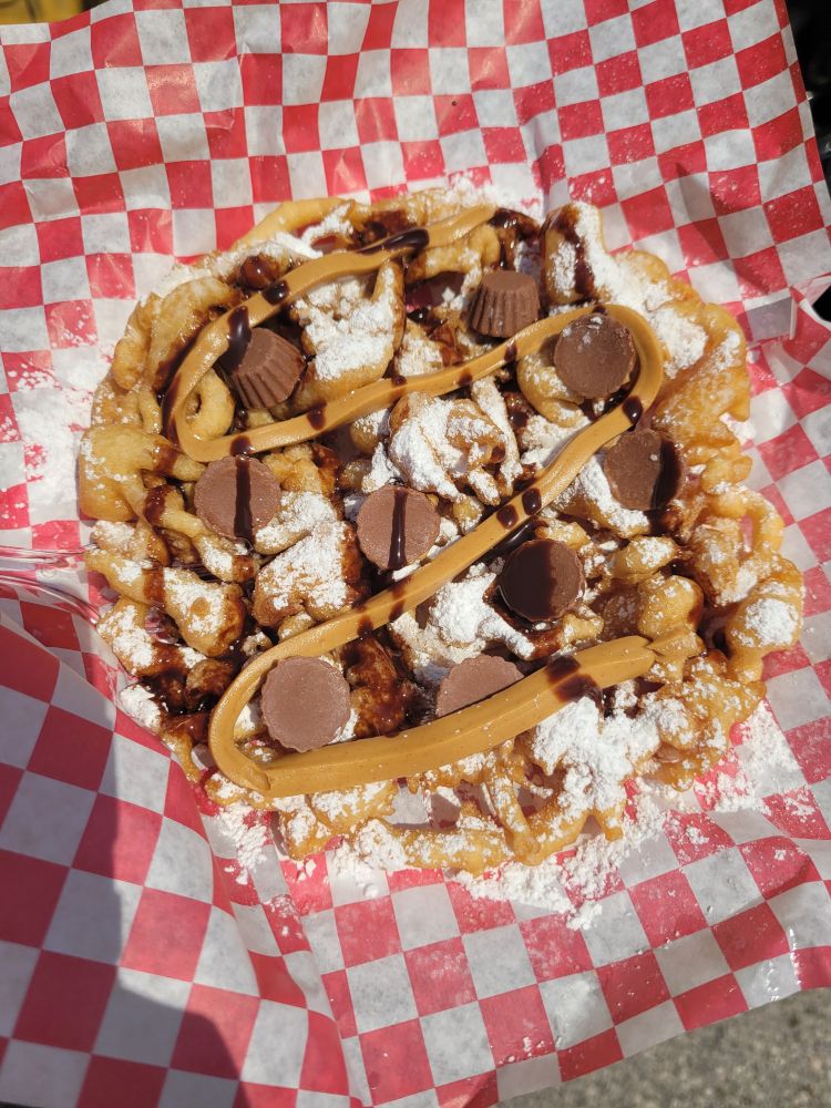 Photo of a reeses cup funnel cake on paper