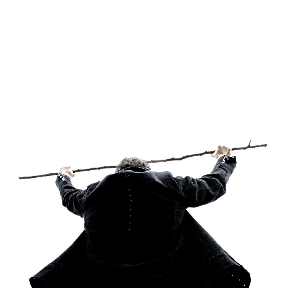 Canadian author Ward McBurney wearing his greatcoat, holding his walking stick to the sky. Never forgotten my friend. 