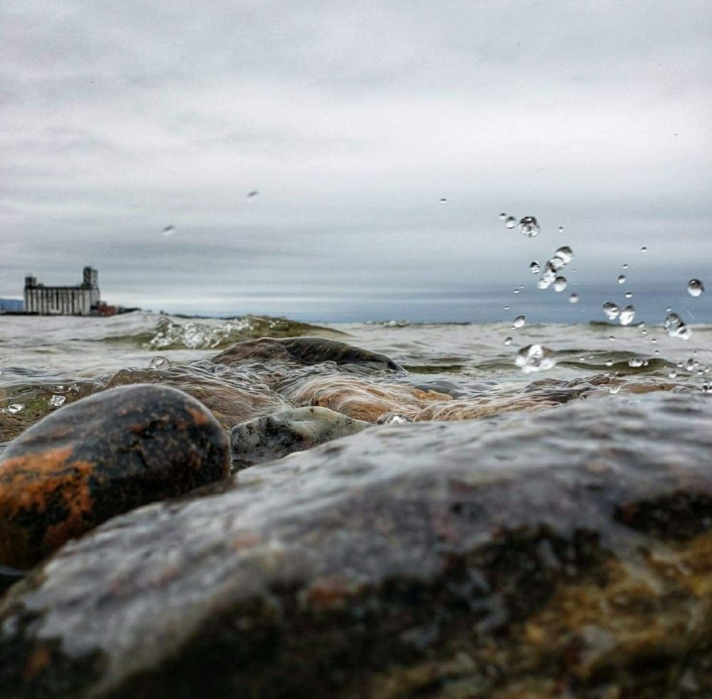 Collingwood Ontario, photo taken at water level, splash frozen in time. Terminal in distance. 