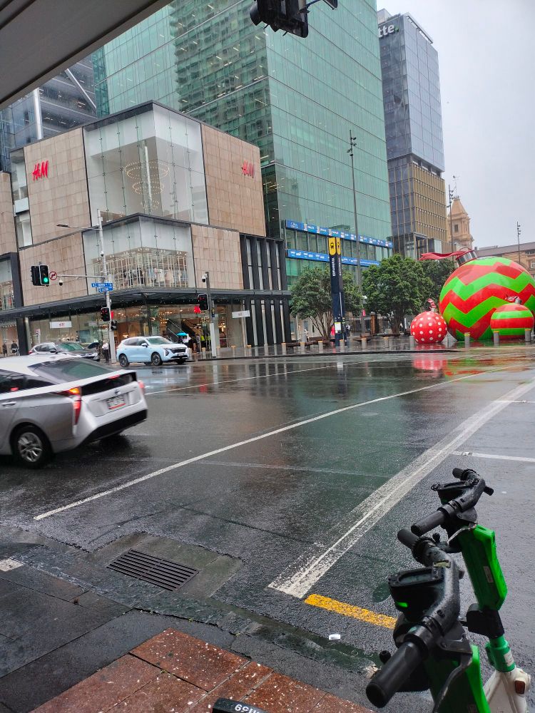 a photo of queen street, where it is currently raining.