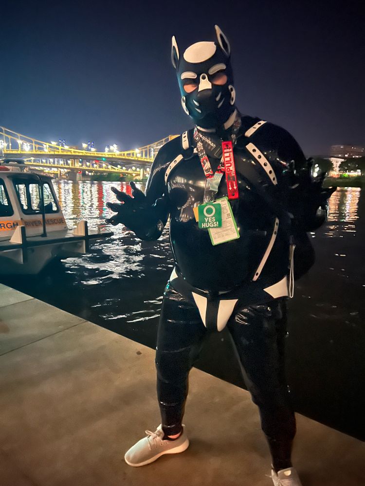 Saix in the same gear and pose posing in front of the waterfront in Pittsburgh.