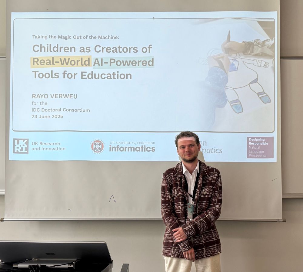 Rayo standing in front of a projector screen with a slide that says “Children as Creators of Real-World AI-Powered Tools for Education”