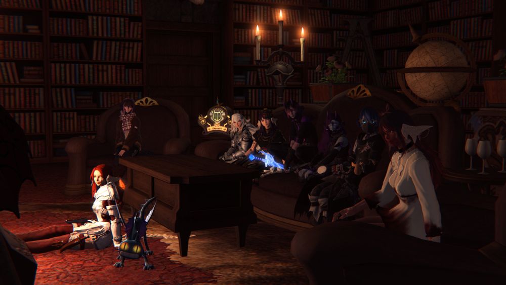 A lounge of lizards (Au Ra) sitting in front of the fireplace of a dark library/studyroom