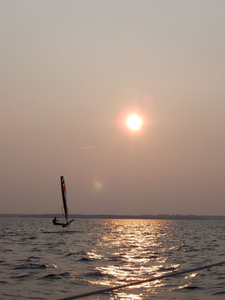 A Waszp hydrofoil sailboat zips away into the the rather dramatic #sunset over the Ottawa River last evening.