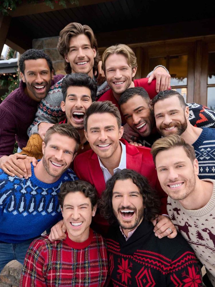 A group of men all smiling