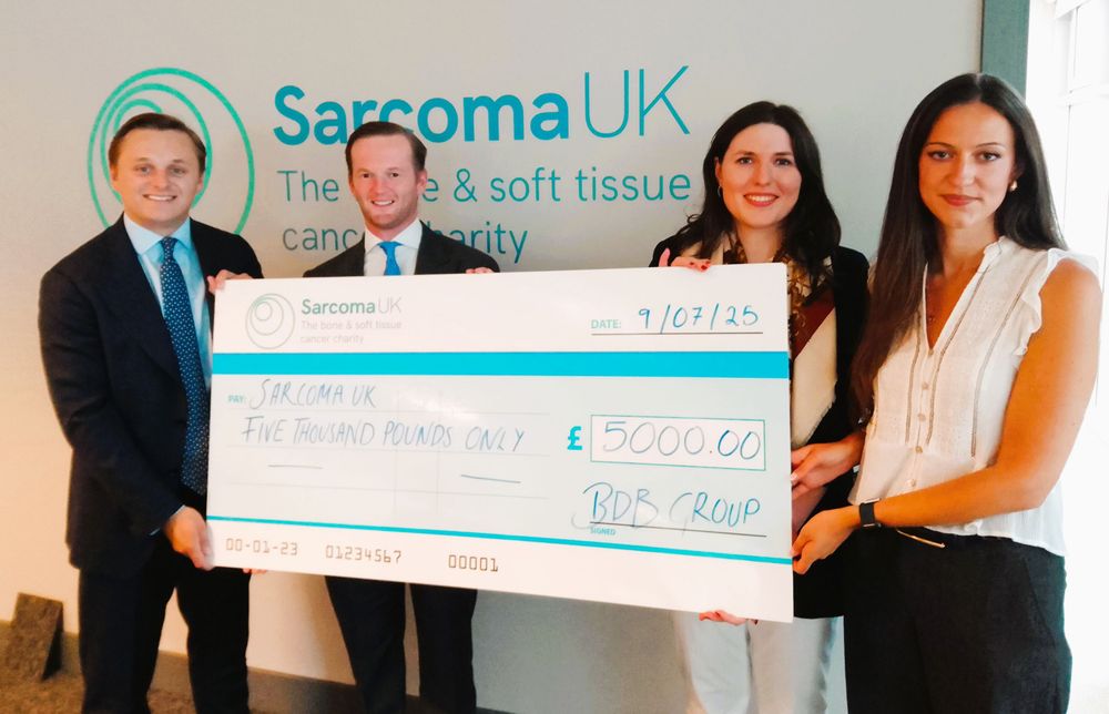 Photo of the Cheque Presentation. Pictured is (from left) Jake, James Turvey and Federica Bambagioni of BDB with Greis Kula, Sarcoma UK’s Corporate and Special Events Officer.