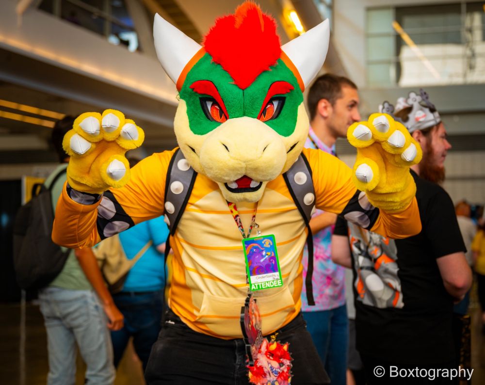 Bowser fursuit head and kigu combo with a RAWR! pose.