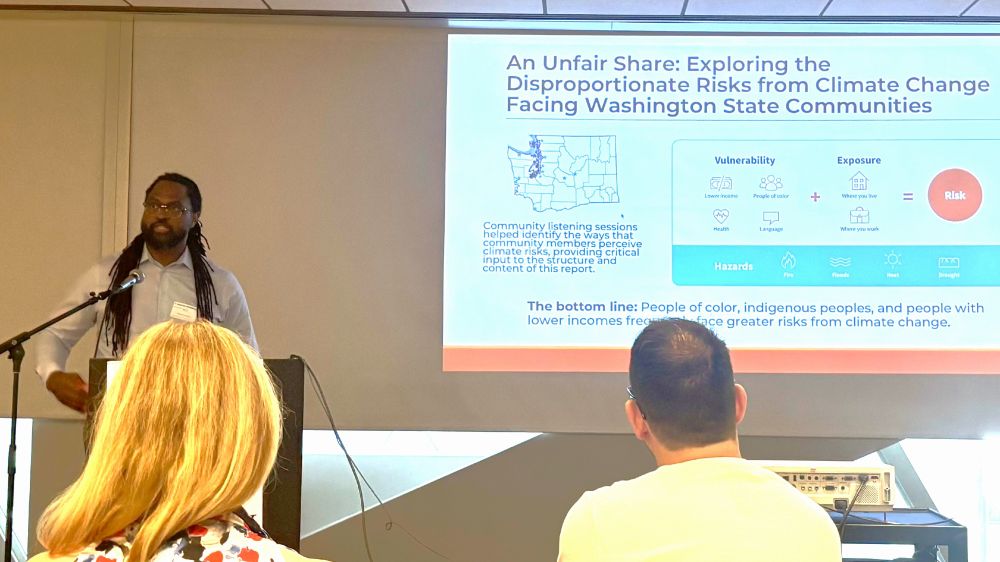 July 16, 2025 — Cameron (left), summarizes findings from Front and Centered's 2018 report, "An Unfair Share: Exploring the Disproportionate Risks from Climate Change Facing Washington State Communities."