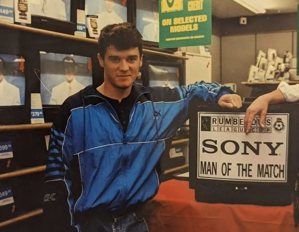 Roy Keane with a TV he won for being the Sony Man of the Match. 