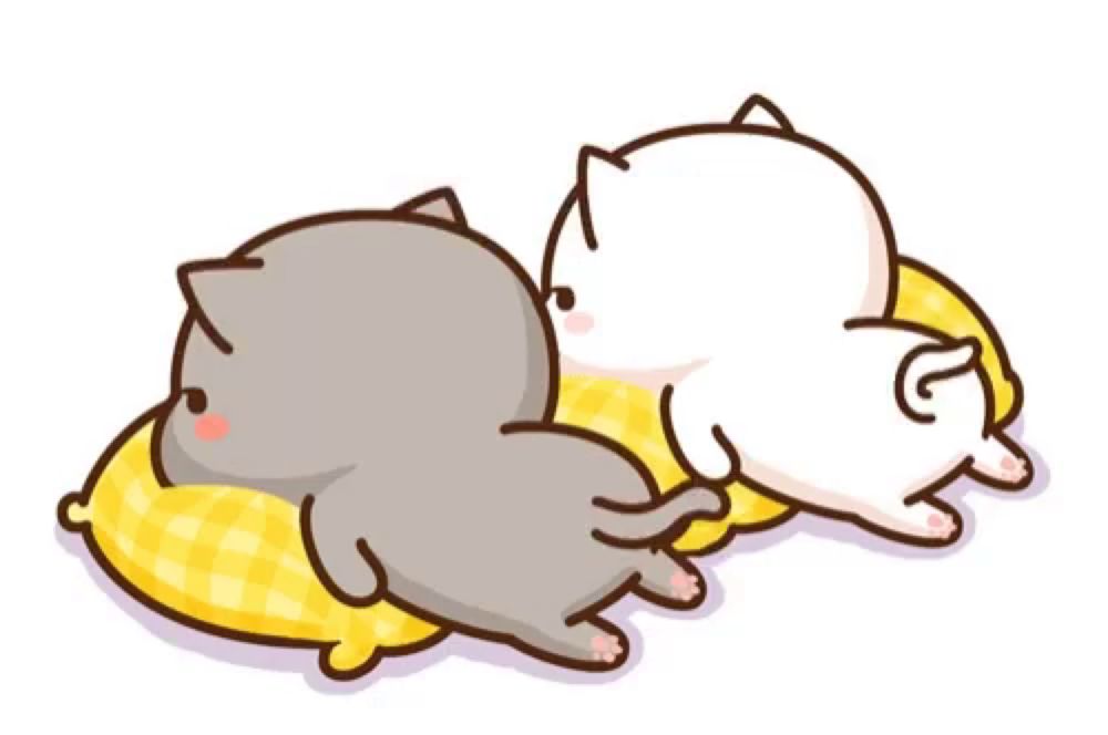 two cats are laying on a yellow pillow