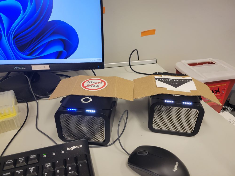 two nanopore p2solos with window hats, one which says no short dna and the other which says lightshield