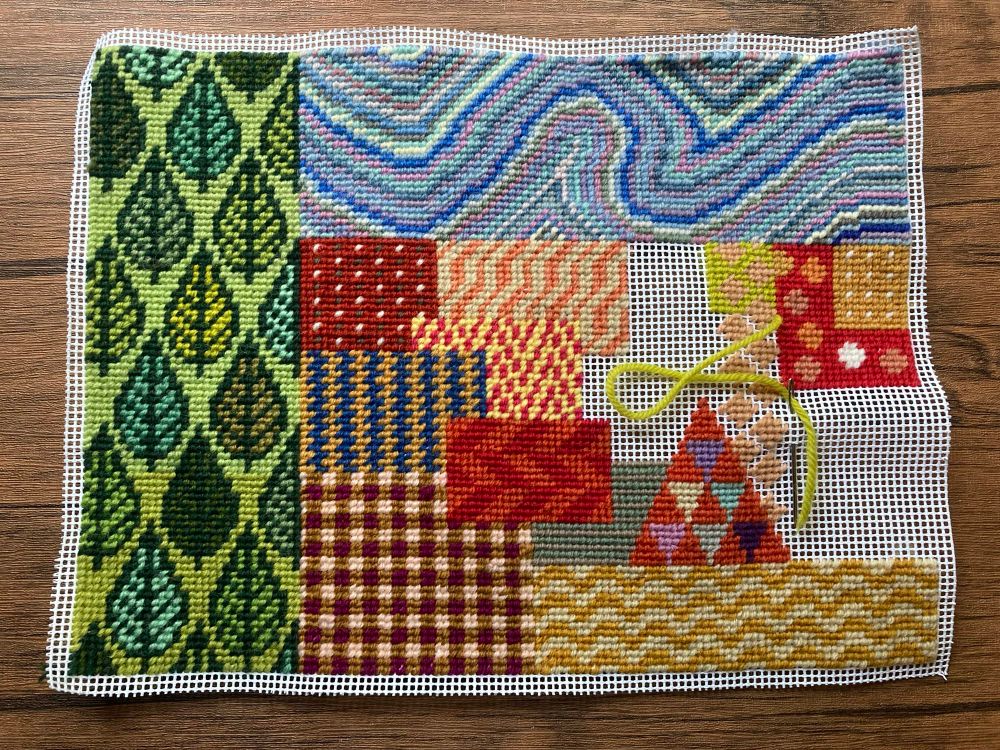 Tapestry work in progress - a mix of colours and motifs