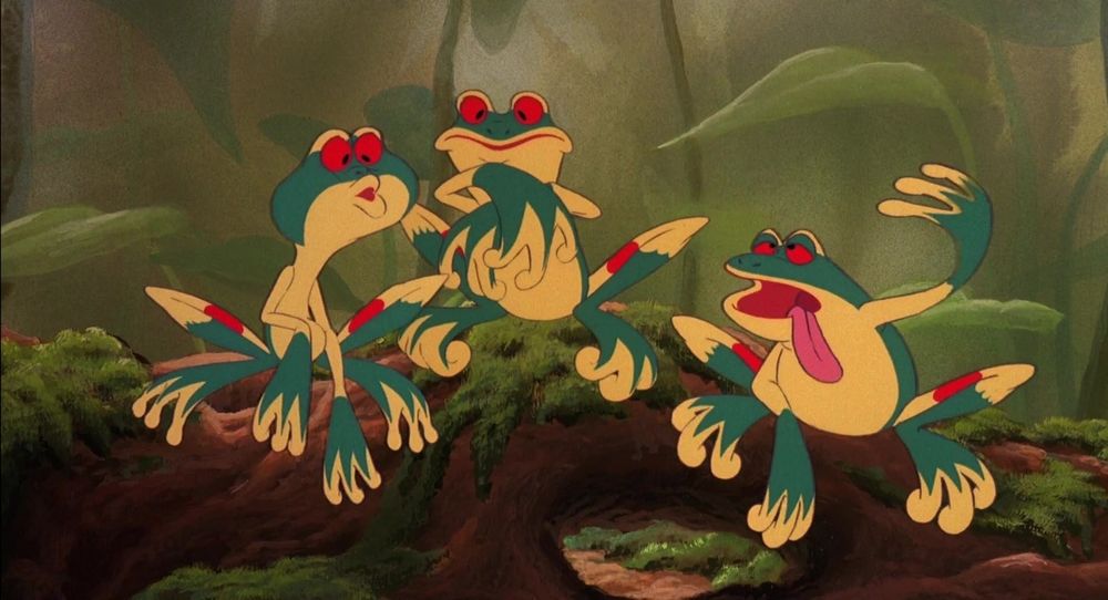 Animated tree frogs. They have very bold colouring, green, yellow and red eyes.