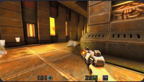 A screen shot from the game Quake 2, of the player holding a gun, and rounding a corner. The main color palette is drab browns and oranges, with subdued hints of green, red and blue.