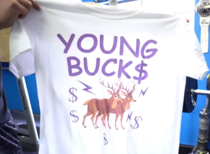 screencap from being the elite of a poorly designed young bucks shirt using comic sans
