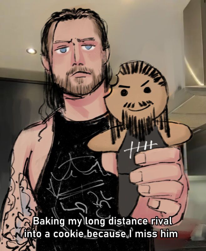 drawing of david finlay, holding a gingerbread man up to the viewer, which is iced and decorated to resemble jay white. cookie jay white has a single bite taken out of his head. caption reads "Baking my long distance rival into a cookie because I miss him"