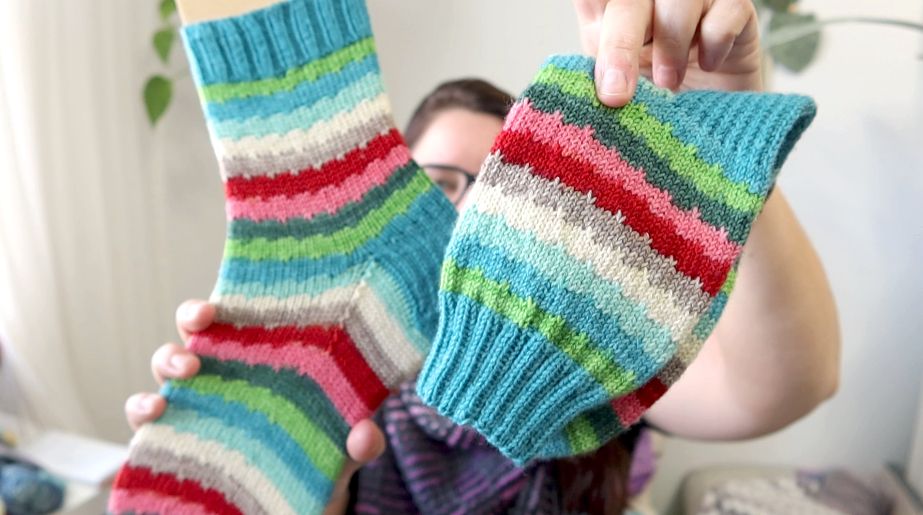 A pair of socks using Freckled Whimsy yarn and the Cold Brew sock pattern by Allison Stuefer