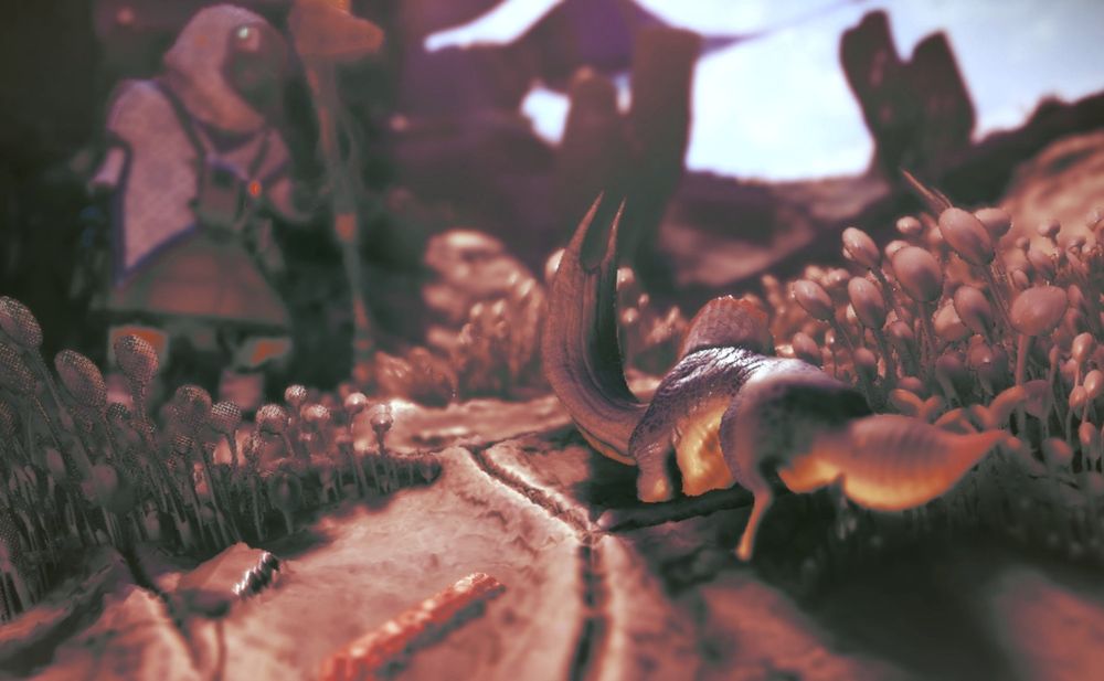 A smol dude looking up at my NMS PC that is blurred in the distance