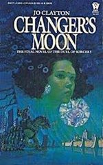 Cover of Changer's Moon, by Jo Clayton, featuring a green-skinned woman's head with flowers in her hair, floating in the sky, with a coyote's face in the moon (or a mirror), above a standard-bearer riding a multi-legged horse thing, advancing on a walled city.