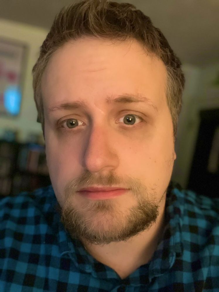 A selfie of me wearing a blue flannel