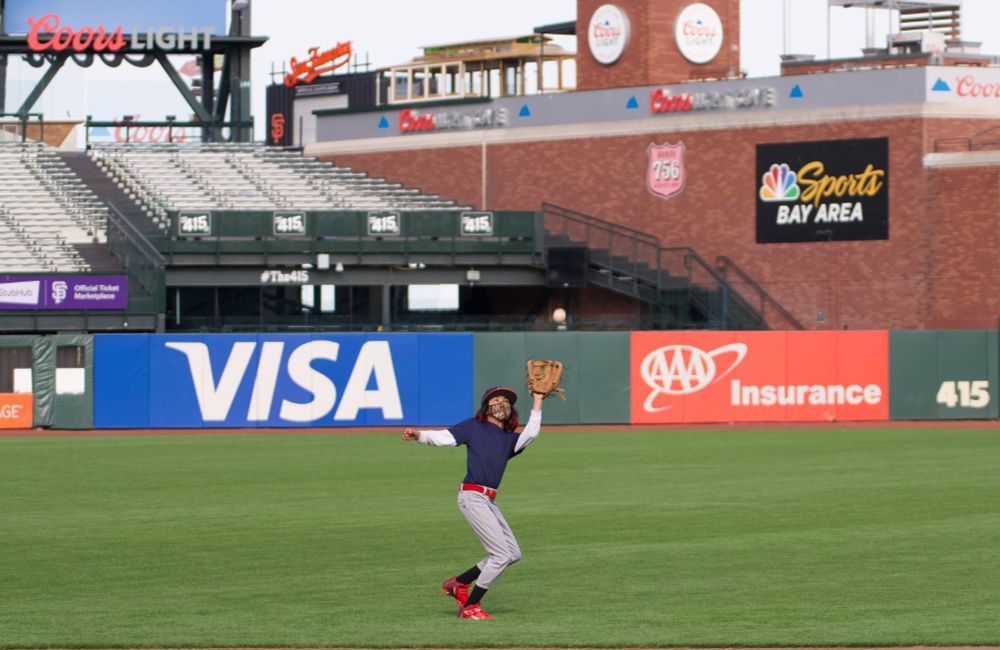 Kid catching baseball on field at Oracle Park