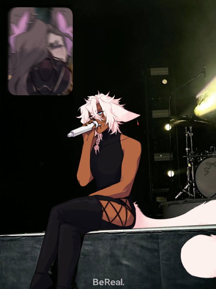 ⭐ a man with white hair, cat ears and a big tail is singing into a mic and sitting on a stage. he looks vaguely displeased and embarassed. in the corner is a blurry image of a man with a mask and jackal ears yelling excitedly in response.