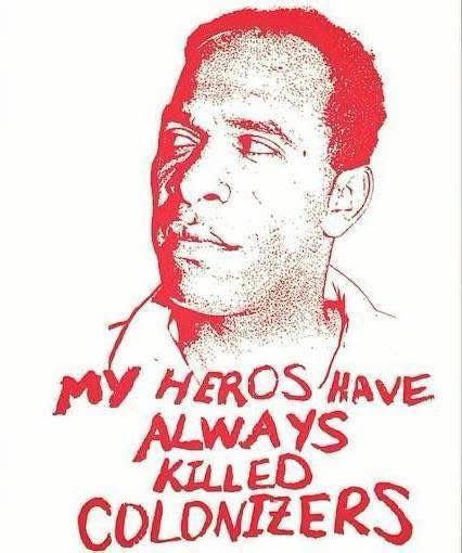 stencil of black man (frantz fanon) looking to one side, background white, he and the text beneath him in red and reads:
my heros have always killed colonizers