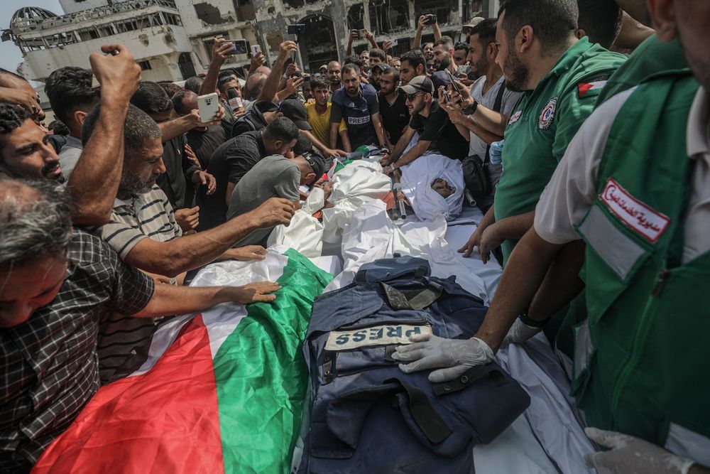 The attack on the journalists came as Israel said it was preparing to invade and take over Gaza City.