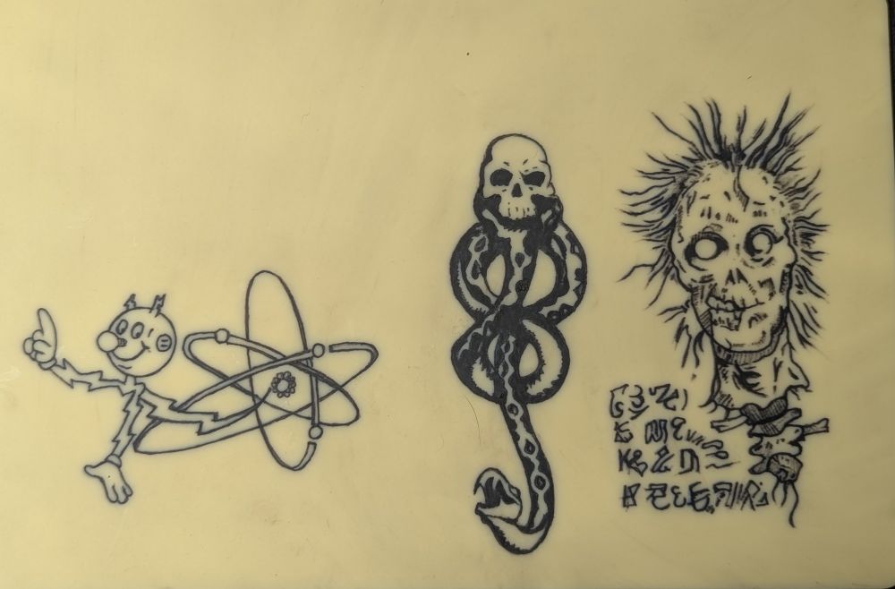 Tattoo practice of ready Kilowatt, a dark mark and a page from the evil dead necronomicon 