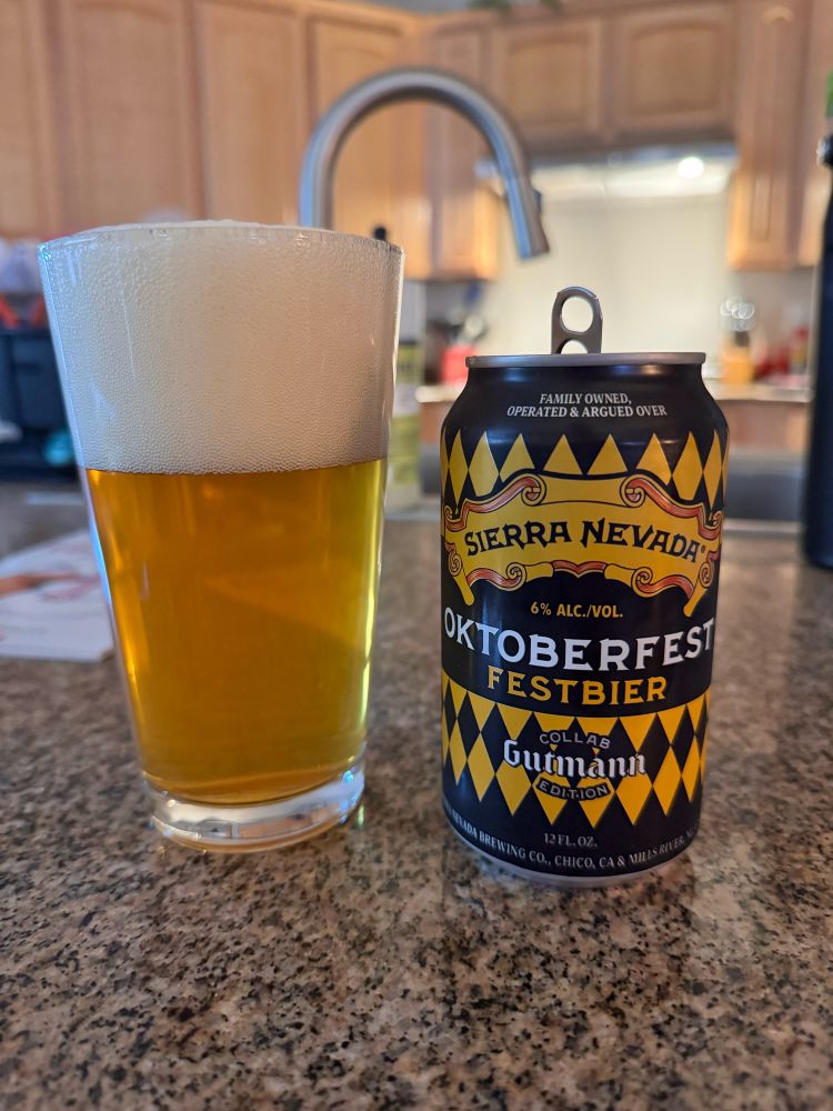Sierra Nevada Oktoberfest in a glass next to an empty can