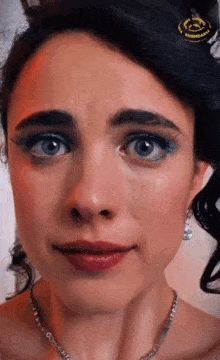 Margaret Qualley forcing a smile in The Substance 