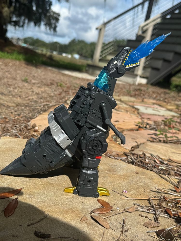 Megatron in beat mode shooting a blast of energy towards the sky in a way to replicate a scene from Godzilla: King of the Monsters (2019)