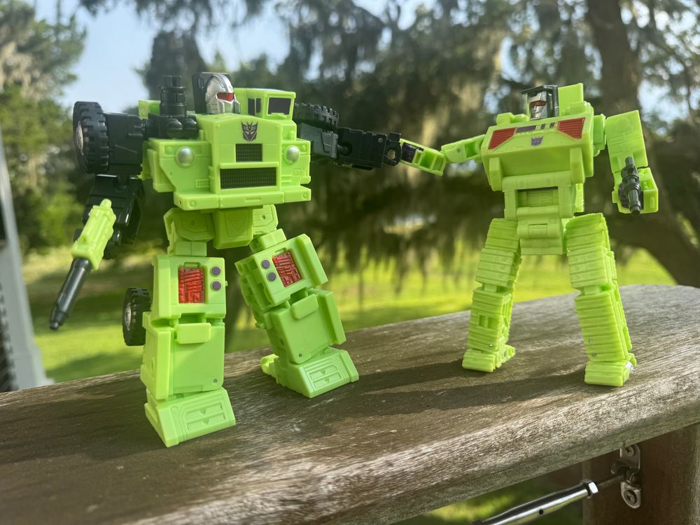 Longhaul (left) fist bumping Bonecrusher (right).