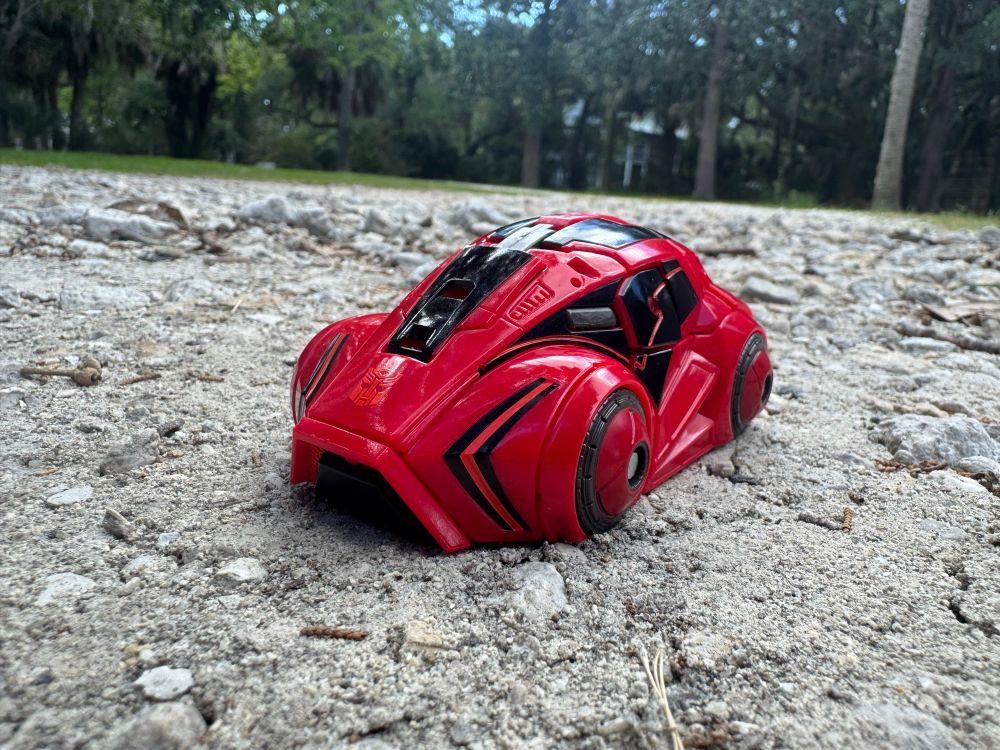 Cliffjumper, in car mode, on a rocky dirt patch.