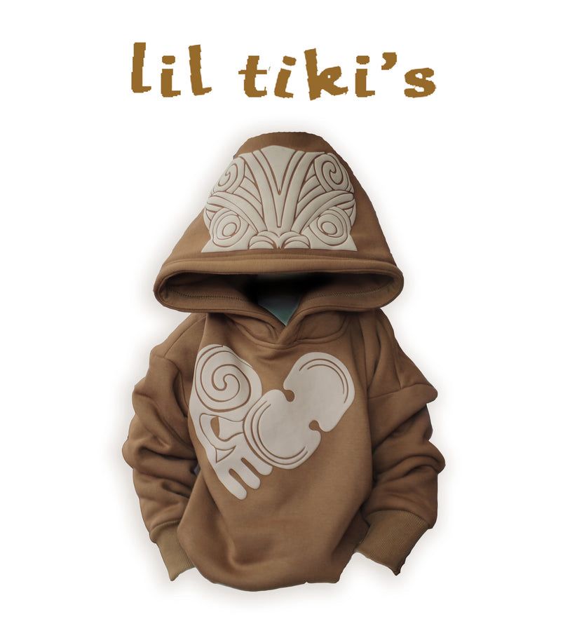Dark Tan kids hoodie with cream colour Māori designs. From J. Mariee Innovative. 