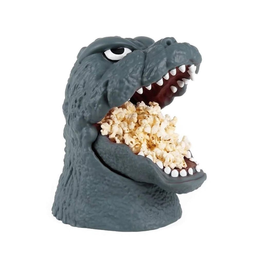 Godzilla popcorn bucket with mouth full of popcorn gaping wide open as he stares into the void
