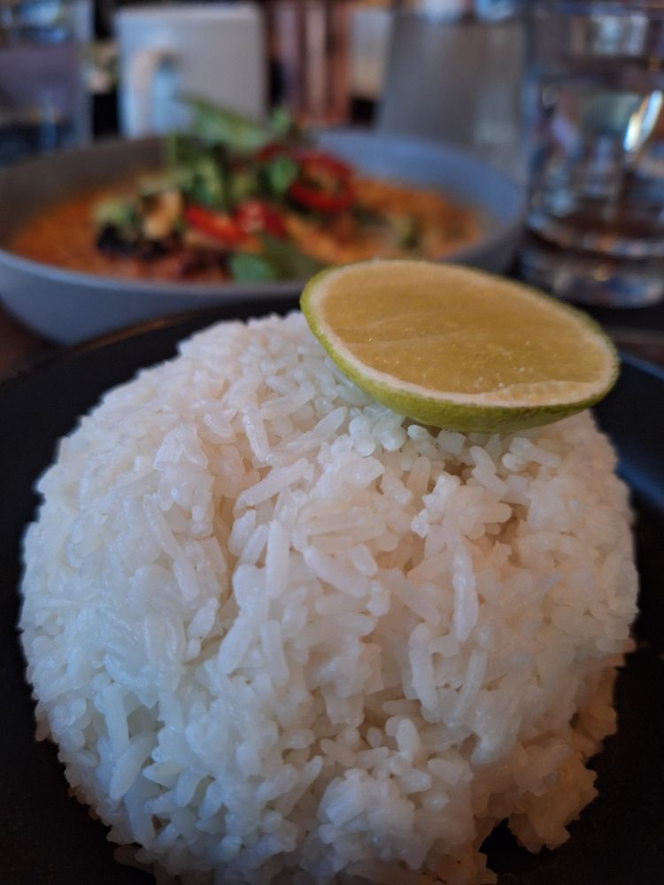 a big ball of rice with a slice of lime worn like a hat