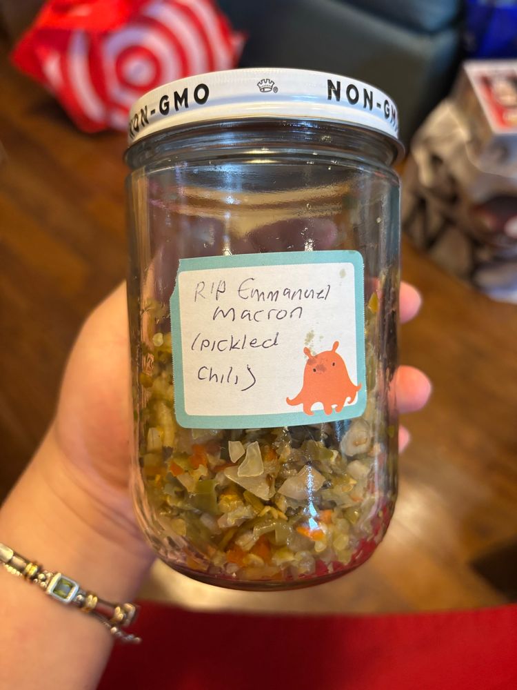 jar of pickled chili w a label that says rip emmanuel macron